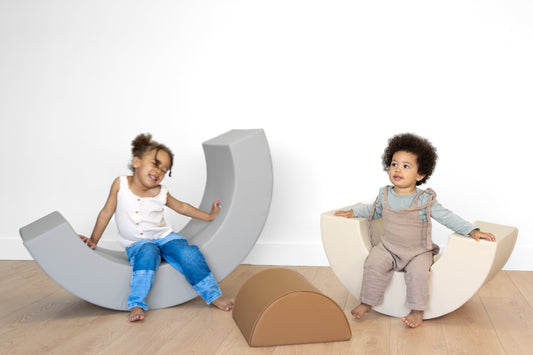 Toddlers playing on North&Nova foam rockers, showing balance, motor development, and indoor play.