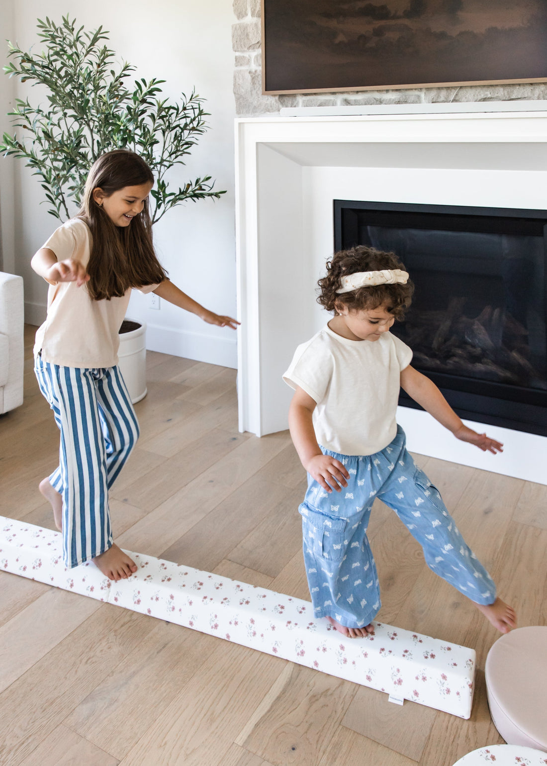 Toddler practicing balance on North&Nova balance beam